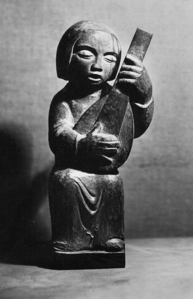 Carving of Figure Playing a Lute